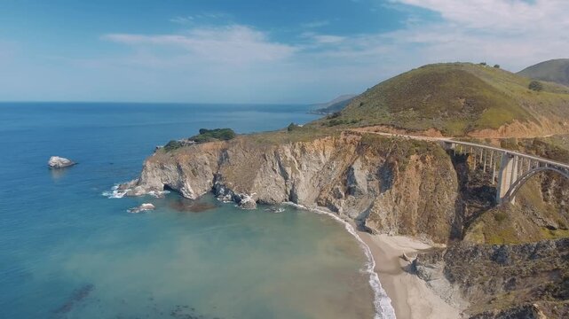 Aerial Bixby Bridge (Rocky Creek Bridge) and Pacific Coast Highway near Big Sur in California, USA America. Drone Shot