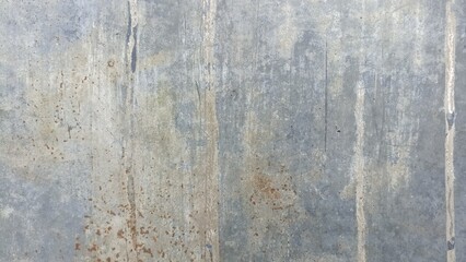 Obraz premium Weathered concrete wall texture with stains and subtle rust marks, suitable for industrial backgrounds, neutral design, or grunge overlays