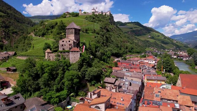 Italy South Tyrol 4K Aerial Drone Flying to Castle with Swimming Pool Scenic Sabiona Monastery and Vineyards in Background Chiusa Klausen Alpine Landscape Travel