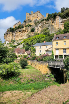 View to the village and castle of Beynac-et-Cazenac, Dordogne, France from the river side walkway during summer