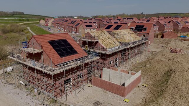 Aerial view of new boulders house with rooftop solar panels