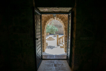 Midyat, Mardin, Turkey – August 21, 2022: Interior view of Mor Gabriel Monastery showcasing historic Syriac Orthodox architecture and stone design © aselight