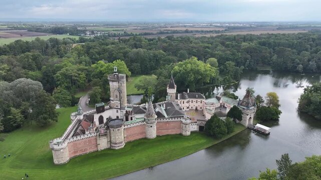 Aerial view of Franzensburg castle surrounded by parkland.