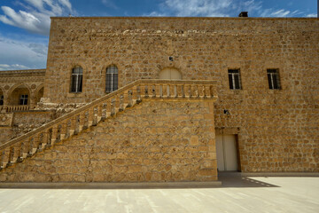 Midyat, Mardin, Turkey – August 21, 2022: Interior view of Mor Gabriel Monastery showcasing historic Syriac Orthodox architecture and stone design © aselight
