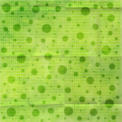 Textured green seamless pattern with soft polka dots on grunge paper background. Organic watercolor style, perfect for eco designs, scrapbooking, packaging and backgrounds. © MedReda
