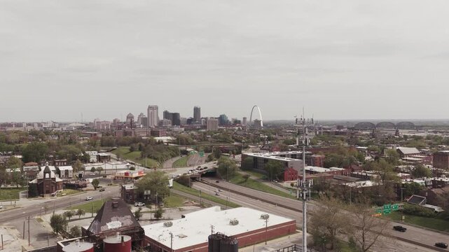 Cityscape view of Saint Louis, MO, with skyscraper buildings and the highway durying a beautiful spring day.