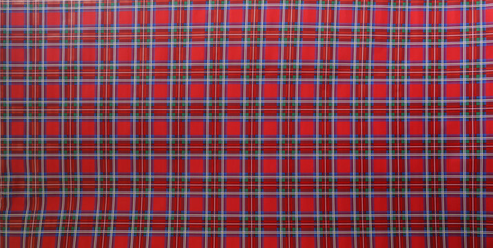 Red green blue white gingham fabric seamless pattern. wrapped paper check plaid. Picnic kitchen tablecloth texture. Gingham square vintage texture. Vector illustration background.