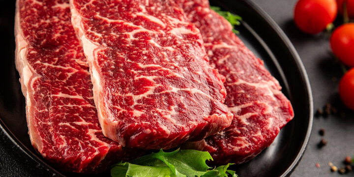 Raw beef steak marbled meat veal tasty snack fresh delicious gourmet food background on the table rustic food top view copy space