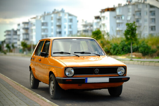 Well-preserved classic yellow Volkswagen Golf Mk1 on the streets of Mersin, Turkey