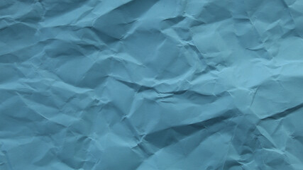 Obraz premium Light blue wrinkled paper texture, abstract background with soft folds and copy space