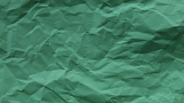 Soft green wrinkled paper texture, abstract natural background with copy space