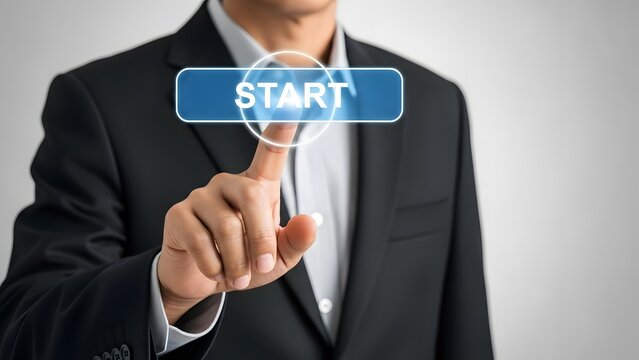 Successful businessman in a dark suit is pressing a glowing blue virtual "start" button with his index finger, symbolizing new beginnings and action.