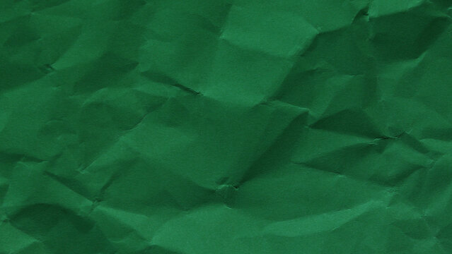 Rich green wrinkled paper texture in horizontal format, natural abstract backdrop