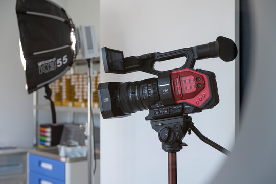 Camera on a tripod during a studio shoot.