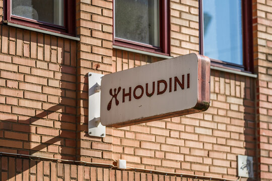 Gothenburg, Sweden - March 06 2026: Houdini sign mounted on brick wall in urban street setting.