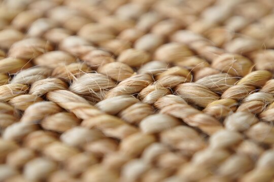 Close-up shot captures the rustic and durable texture of tightly woven natural fibers, forming an intricate pattern.