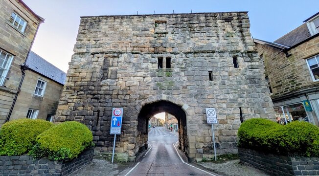 Alnwick old low tunnel castle walls in town centre 