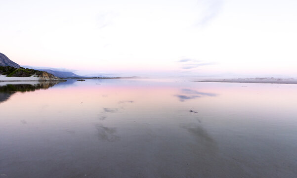 lagoon and reflection on water after sunset, Hermanus, South Africa