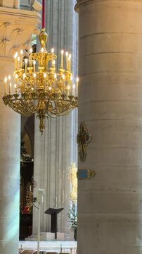 Guests converse quietly. Calm visitors rest inside cathedral space