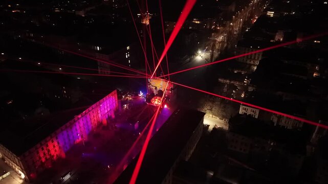 Celebrating the start of 2026 with a grand light show at Siegestor. Thousands of people enjoy the midnight illumination on Ludwigstrasse during the New Year's Eve Mile in Munich.
