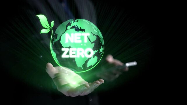 Hands cradle a glowing Earth with a green leaf, representing the concept of net zero emissions and a commitment to sustainability for a better future. Qubit