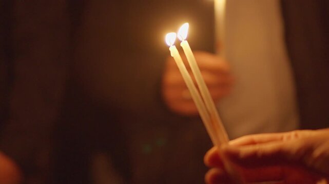 Candlelight prayer church mass gathering with people holding candles