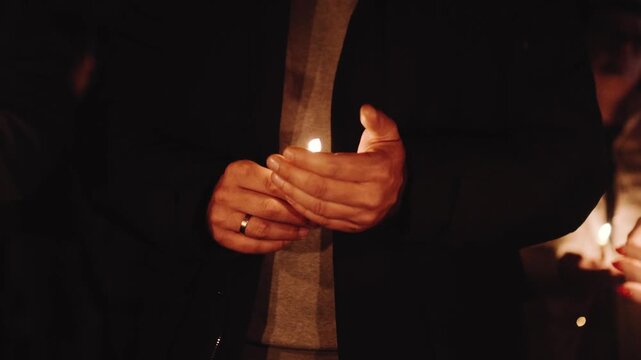Candlelight prayer church mass gathering with people holding candles