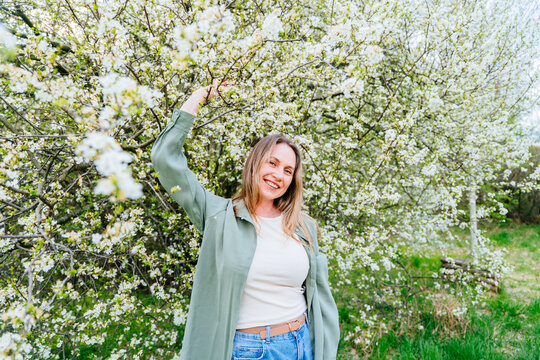 Positive midlife woman mental health wellbeing smiling at camera