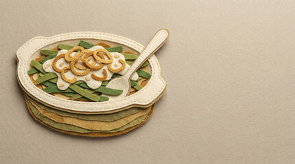 Fototapeta premium Green bean casserole with crispy onions served in dish on table 