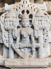 Obraz premium Ranakpur Jain Temple in Rajasthan, built in the 15th century and dedicated to Adinatha, is famed for its marble design, 1,444 unique pillars, symmetry, and serene spiritual ambiance.