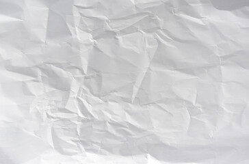 Fototapeta premium White crumpled paper background, blank wrinkled sheet