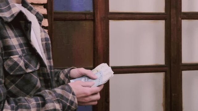 closeup male hands hold Moroccan dirham money, count paper dirham banknotes, concept cash payments, monetary savings, save for vacation, exchange and cashing currency