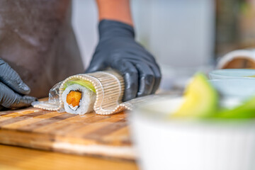 Chef rolling peruvian japanese fusion maki sushi © Guillermo Spelucin