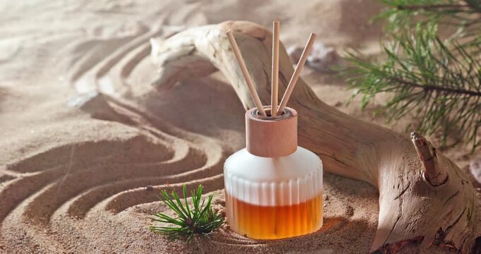 Intense fragrance diffuser on sandy beach in summer.