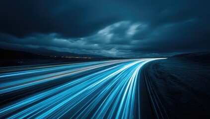 Obraz premium Abstract Light Trails on a Dark Highway at Night.