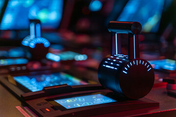 Engine telegraph detail on vessel navigation bridge at night © DMITRII RYBALKA
