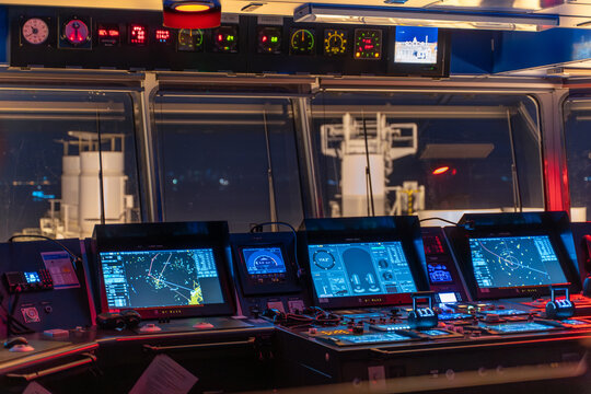 Vessel bridge interior with navigation systems and fore deck view