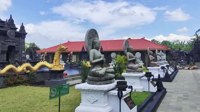 Buddhist Temple Garden with Meditating Buddha Statues and Golden Dragons