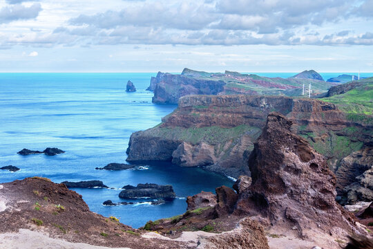 Viewpoint Calhau da Furna do Bode on Madeira, green hills meet sea, discovery archipelago landscape, volcanic island travel, adventure vacation, colorful rooftops, Madeira, Portugal