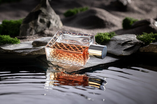 Intense golden perfume in a lunar landscape with water.