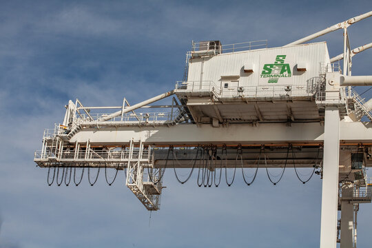 SSA‑operated gantry crane machinery with suspended service lines at the Port of Oakland
