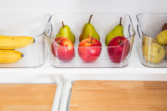 apples and pears in tidy organized pantry, healthy eating and decluttered home
