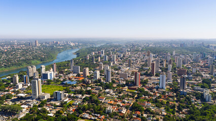 Aerial skyline of Foz do Iguaçu with Paraná River separating Brazil from Ciudad del Este skyline in Paraguay. © Marcio Eneas