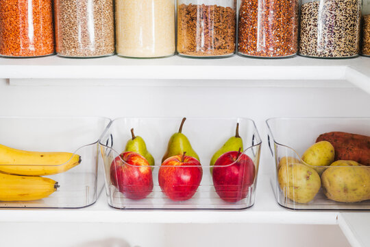 apples and pears in tidy organized pantry, healthy eating and decluttered home