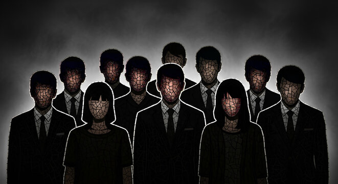 Group of faceless business people standing in dark background.