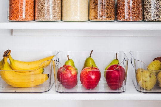apples and pears in tidy organized pantry, healthy eating and decluttered home
