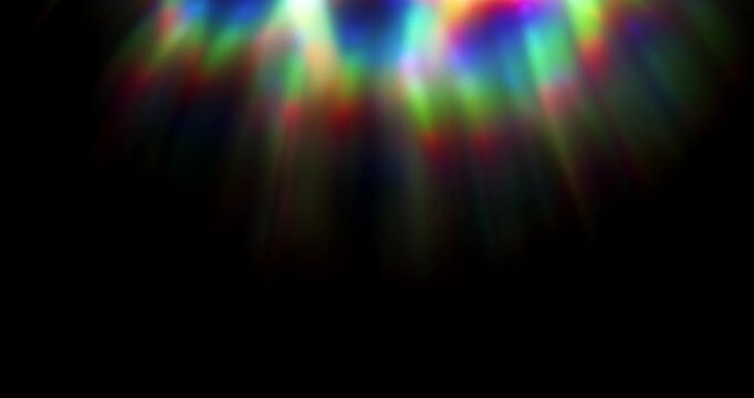 Light shining into a prism creating lens flare in a vivid rainbow of random dancing light rays. Optical effect of a light refraction creating chromatic aberration in a spectrum colors. Loop