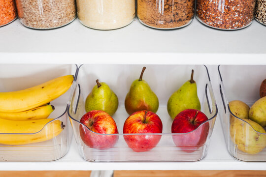 apples and pears in tidy organized pantry, healthy eating and decluttered home