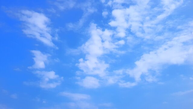 Calming blue sky with white clouds