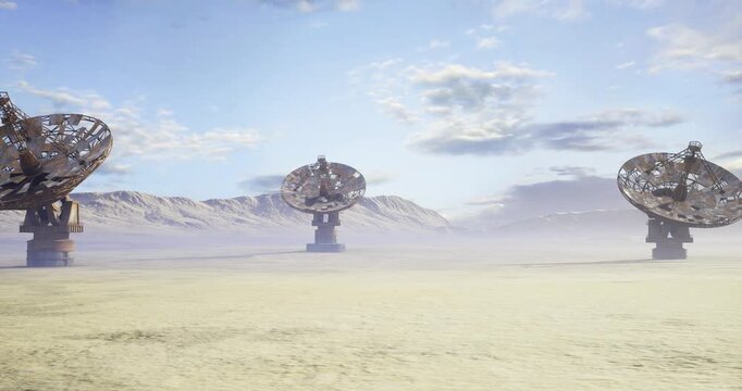decommissioned radar sculptures stand on arid plain, weathered metal and rusted frames evoke history, tumbleweed and wind carry dust across silent field